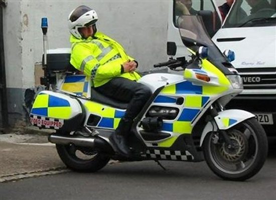 Cop asleep on motorcycle extended