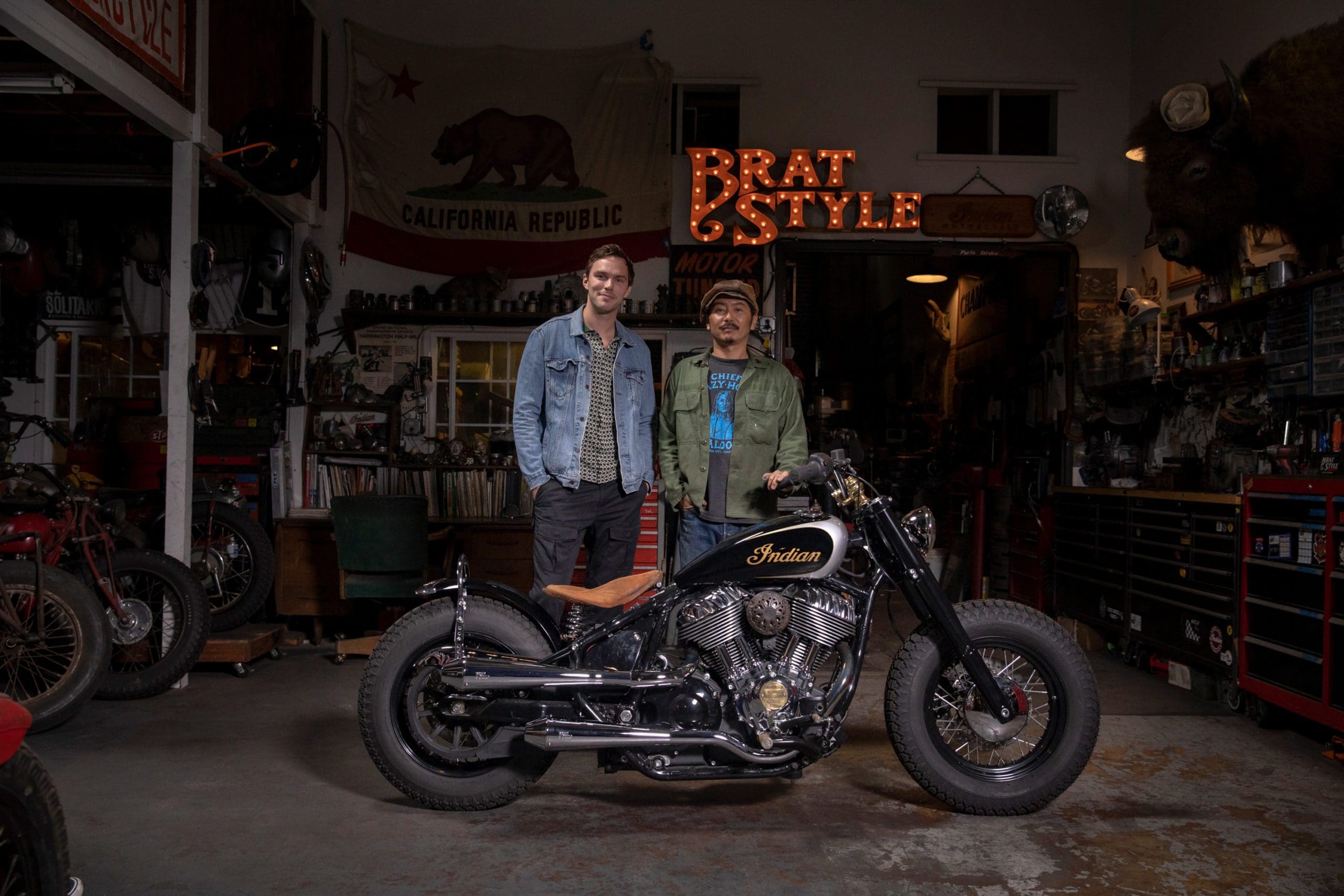 The Brat-Style Indian Super Chief Limited tricked out for actor Nicolas Hoult, modded out by Brat-Style founder Gō Takamine: side view with Hoult and Takamine
