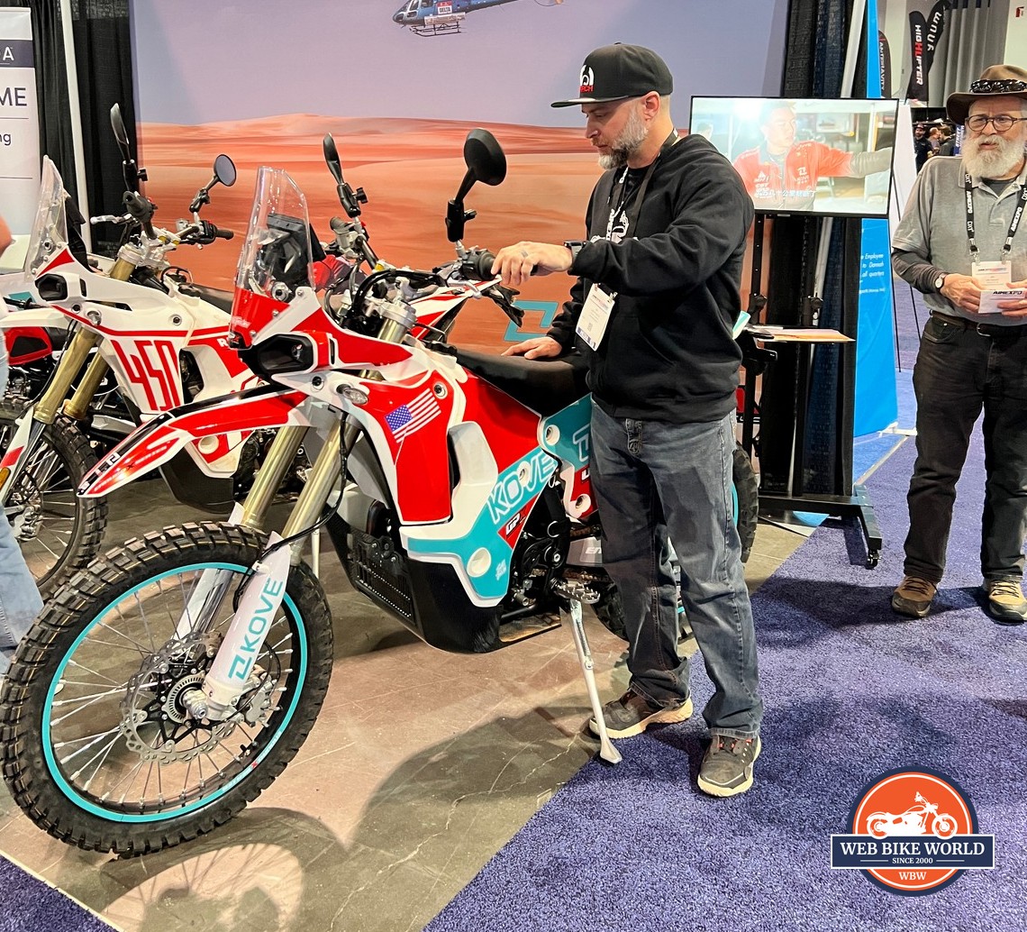 Jim standing next to Kove's FSE450R Rally motorcycle.