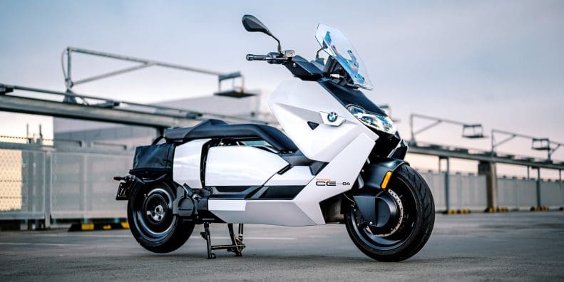 BMW's CE-04 electric scooter on a carpark rooftop at sunset