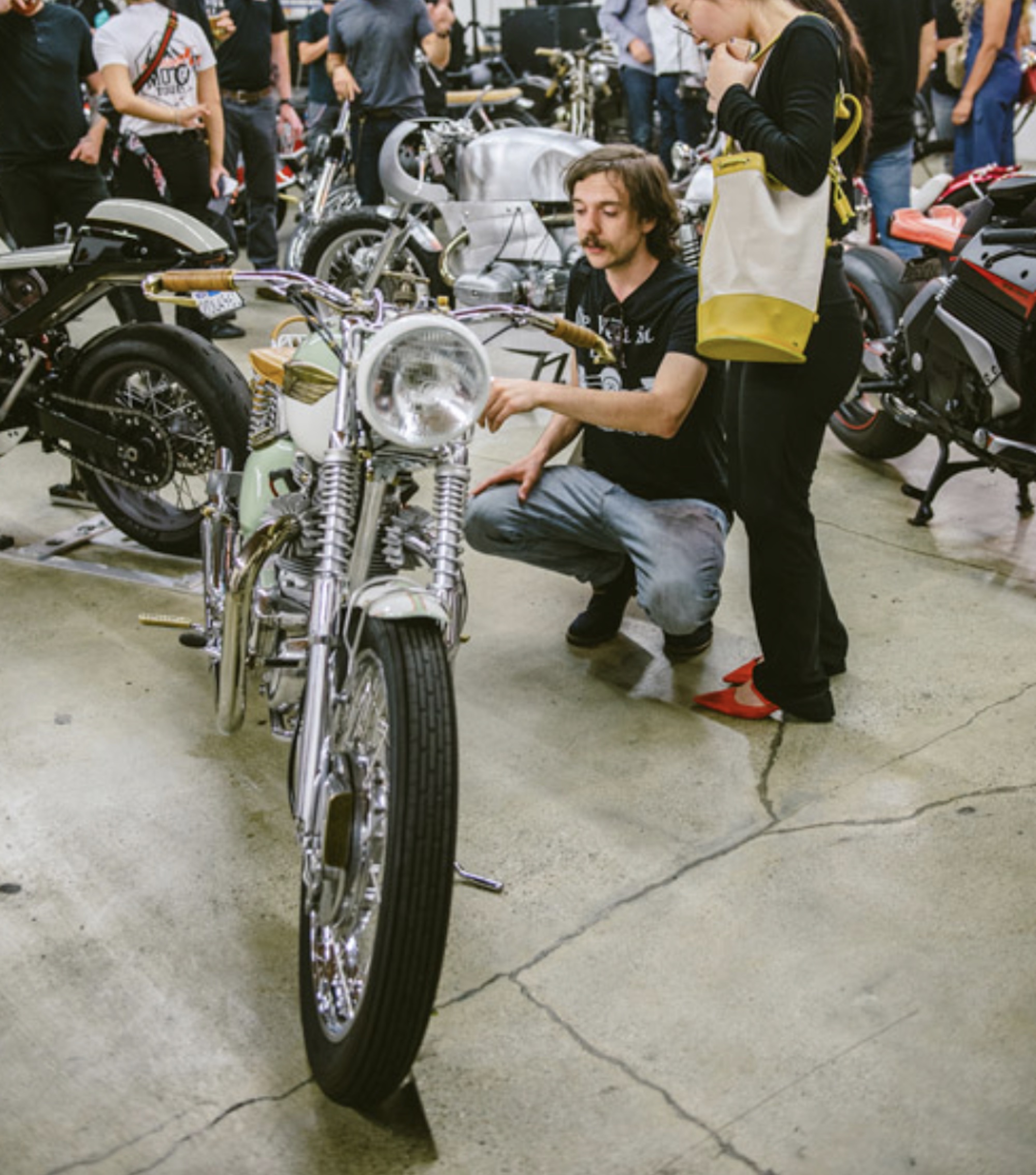 A bike receives attention at the Lightning Bolt USA Custom Motorcycle Building Challenge. Media sourced from The Lightning Bolt's website. 