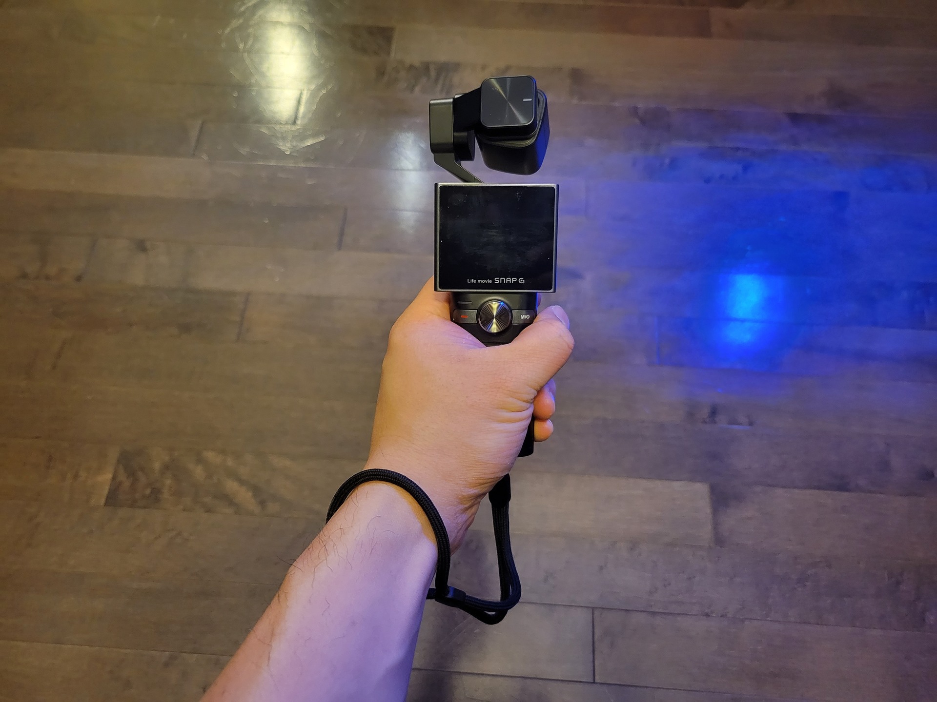 Holding the gimbal with wrist strap on