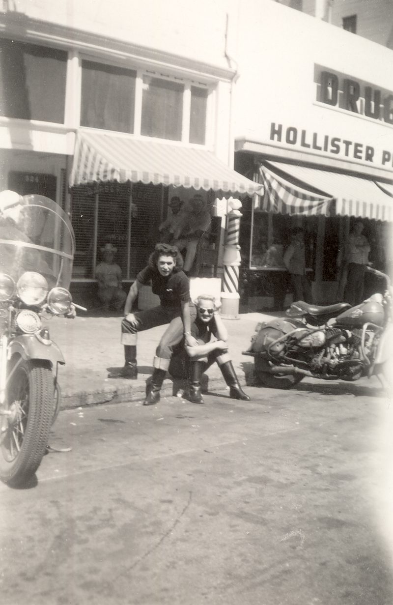 Two members of the Tracy Gear Jammers sitting on a Hollister, CA. street corner in July, 1947