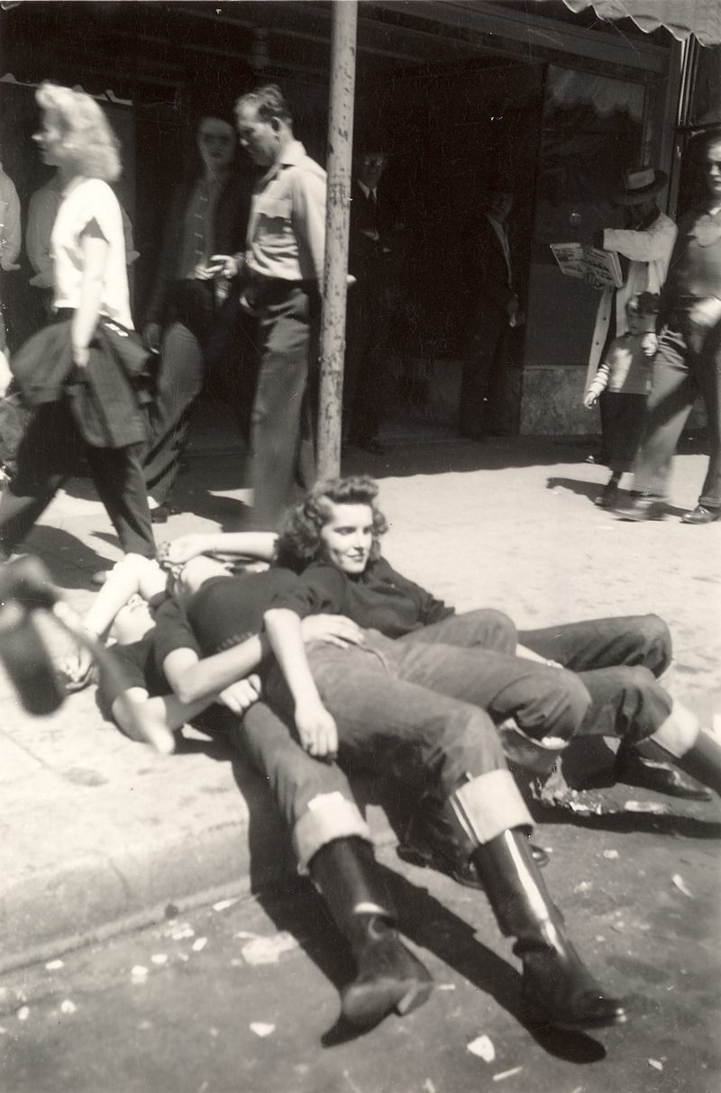 Three members of the Tracy Gear Jammers sitting on a Hollister, CA. street corner in July, 1947