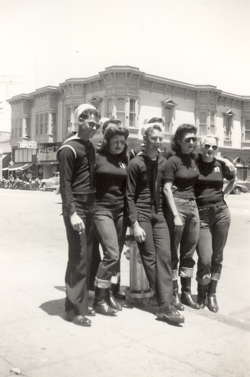 Male sailors pose with female members of the Tracy Gear Jammers on a Hollister, CA. street corner in July, 1947