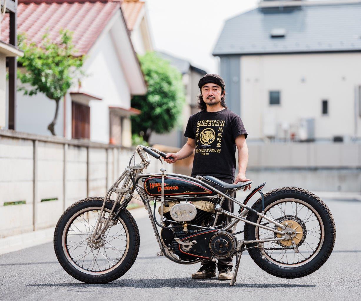 Custom Harley-Davidson motorcycle with builder on Tokyo street