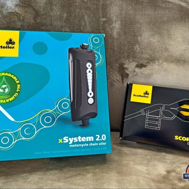 The Scottoiler xSystem 2.0 and Scorpion Dual Injector in their respective boxes.