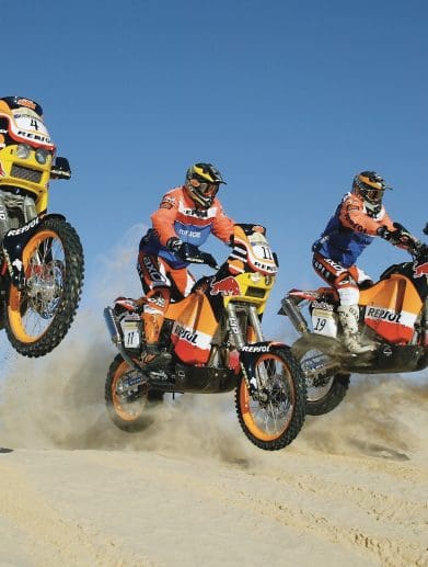 2004's Team Repsol (Honda), revving through the Dakar Rally. Media sourced from KTM.