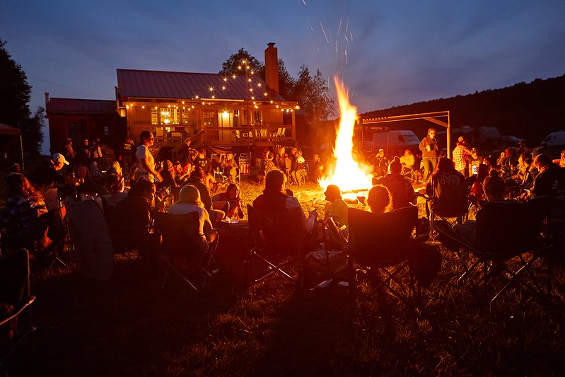 Over and Out attendees at a nighttime bonfire