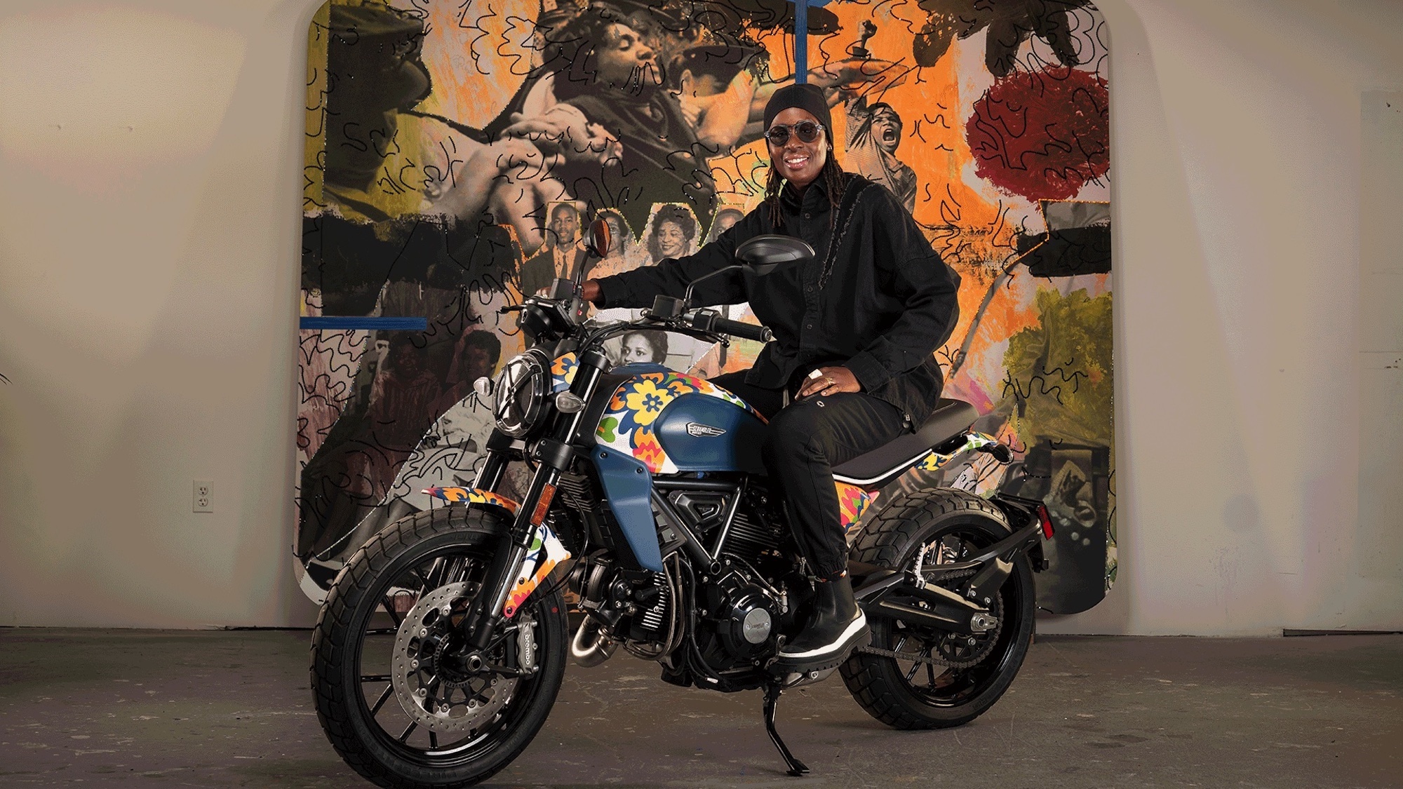 A view of Ducati's next-gen Scrambler Icon - a bike that's recently had a new livery scheme from RXART artist Mickalene Thomas, in support of art in children's hospitals. Media sourced from Ducati.