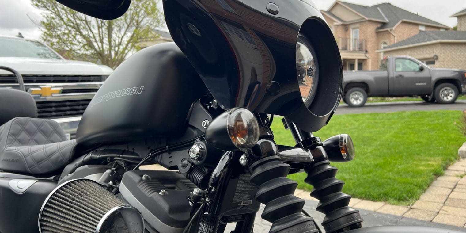 Close up side profile of the fairing & turn signal relocation kit installed on motorcycle