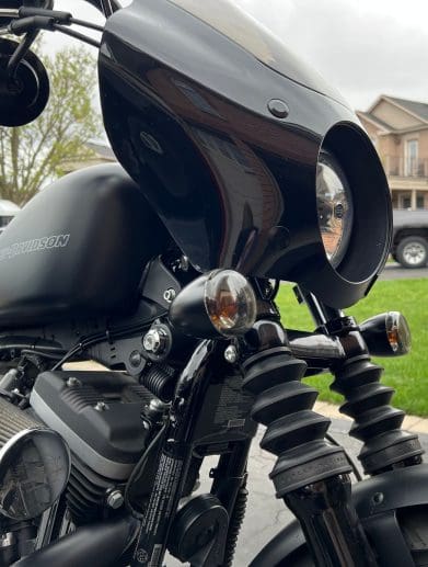 Close up side profile of the fairing & turn signal relocation kit installed on motorcycle