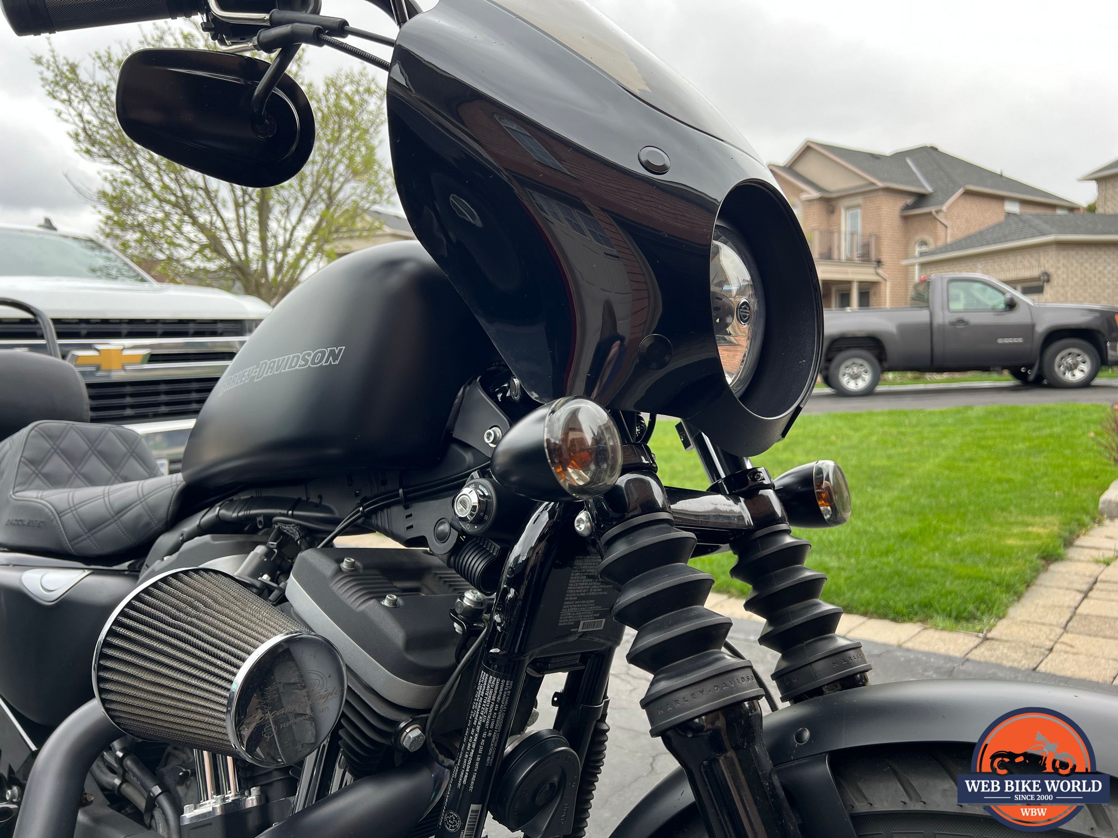 Close up side profile of the fairing & turn signal relocation kit installed on motorcycle