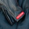 Black Pup Moto's new Rumbler Jacket on a rider - detail shot of label Black Pup Moto's new Rumbler Jacket on a rider - detail shot of label