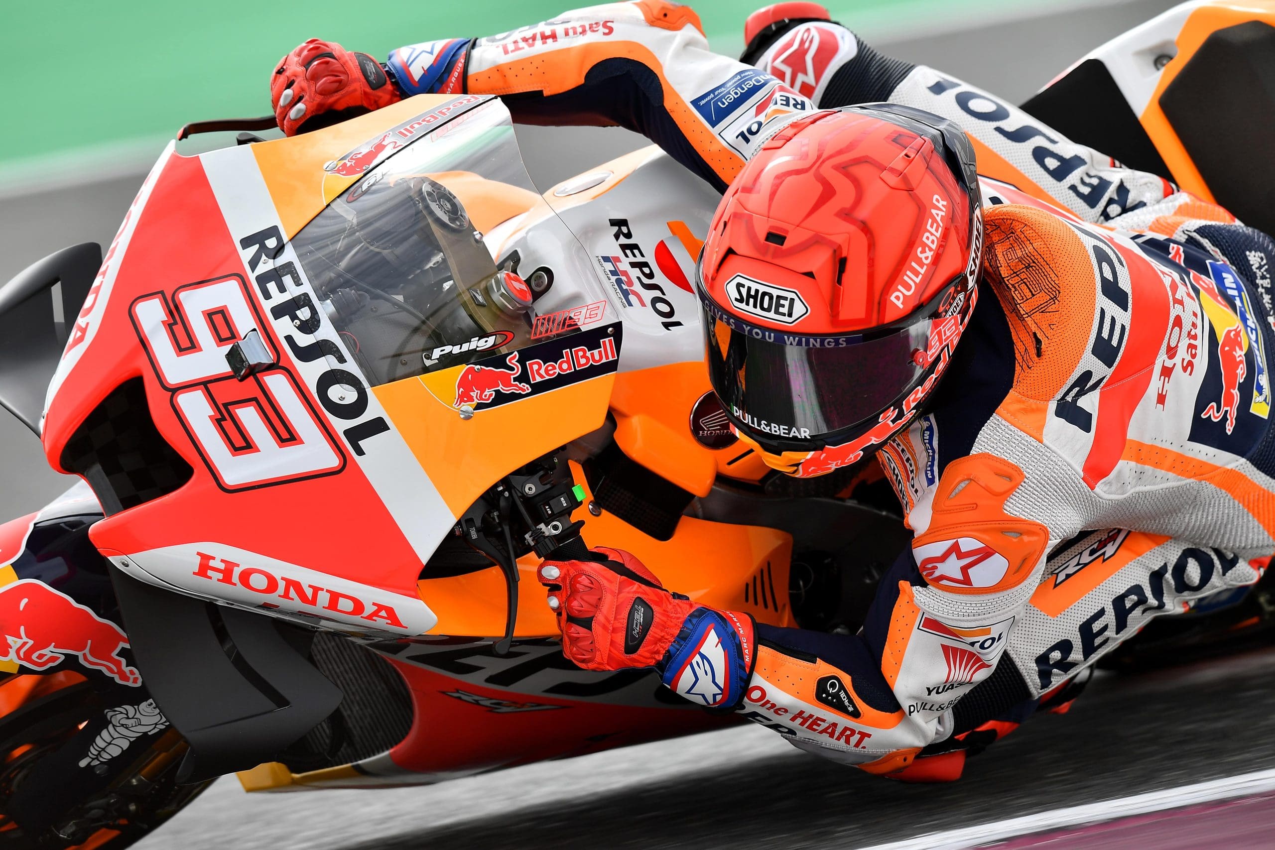 Marc Marquez leaned hard into a turn in a race.