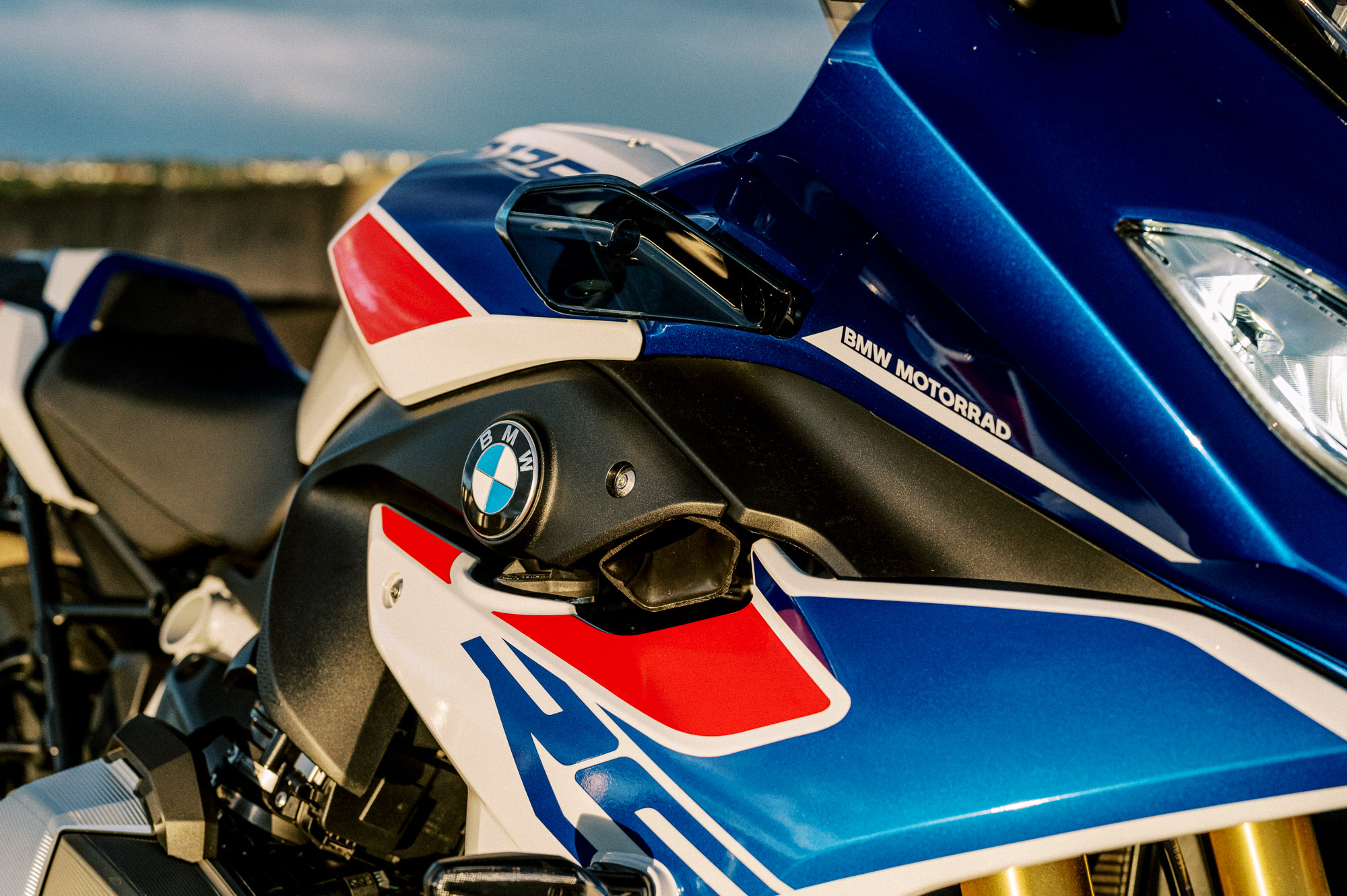 a detail of BMW's 2023 R 1250 RS motorcycle parked at sunset in Sydney