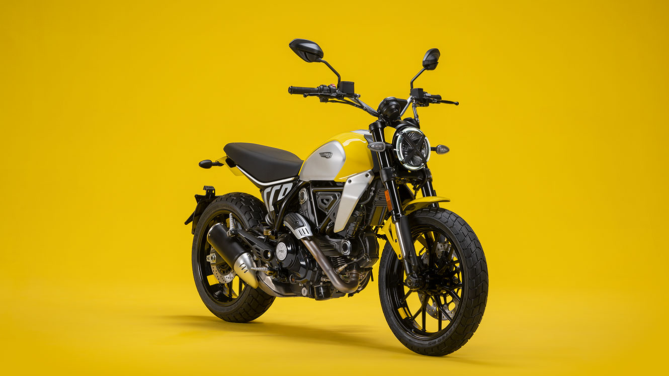 Ducati's "Scrambler" motorcycle on a yellow studio background