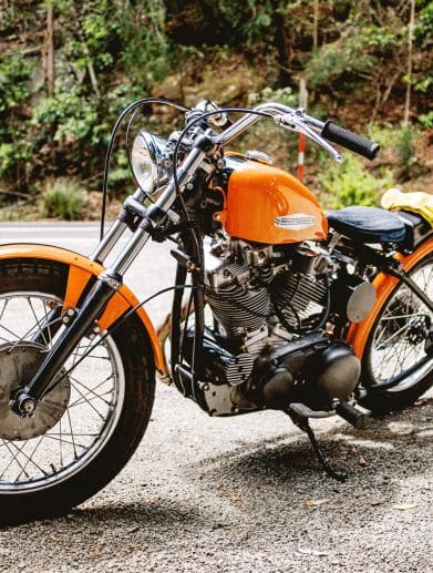 A classic Harley-Davidson Sportster motorcycle from the 1960s is park by the side of the road in Sydney, Australia
