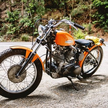 A classic Harley-Davidson Sportster motorcycle from the 1960s is park by the side of the road in Sydney, Australia