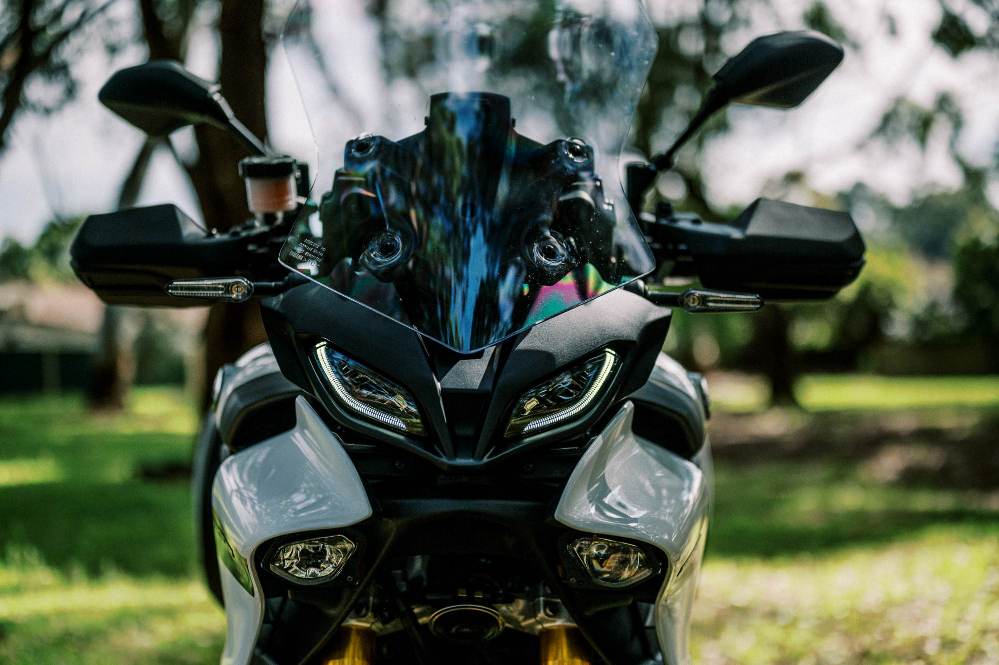 A detail shot of a 2023 Yamaha Tracer 9 GT Motorcycle in a Sydney Park