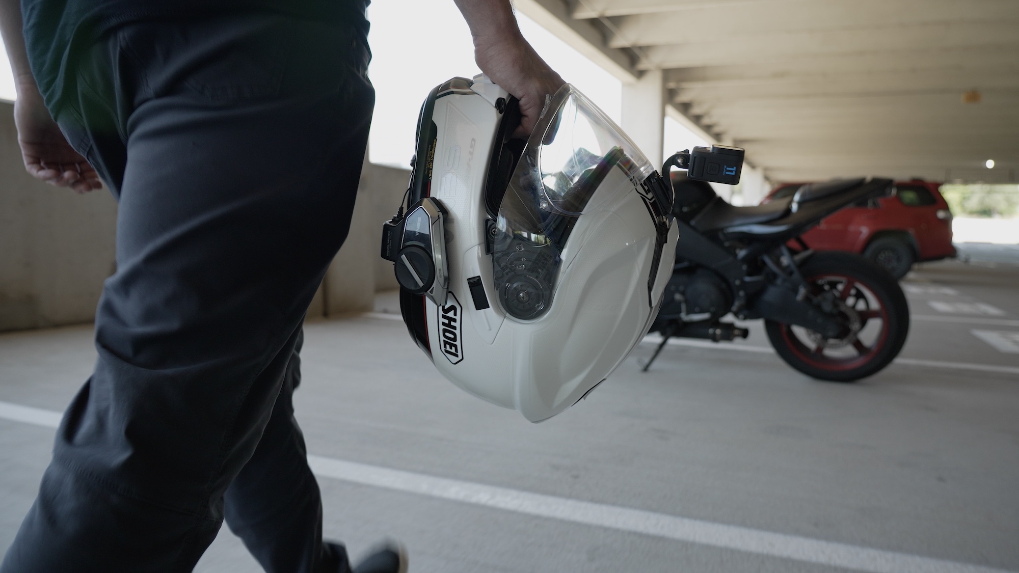 A motorcycle rider using their GoPro in synchronization with their Sena comm. Media sourced from Sena.