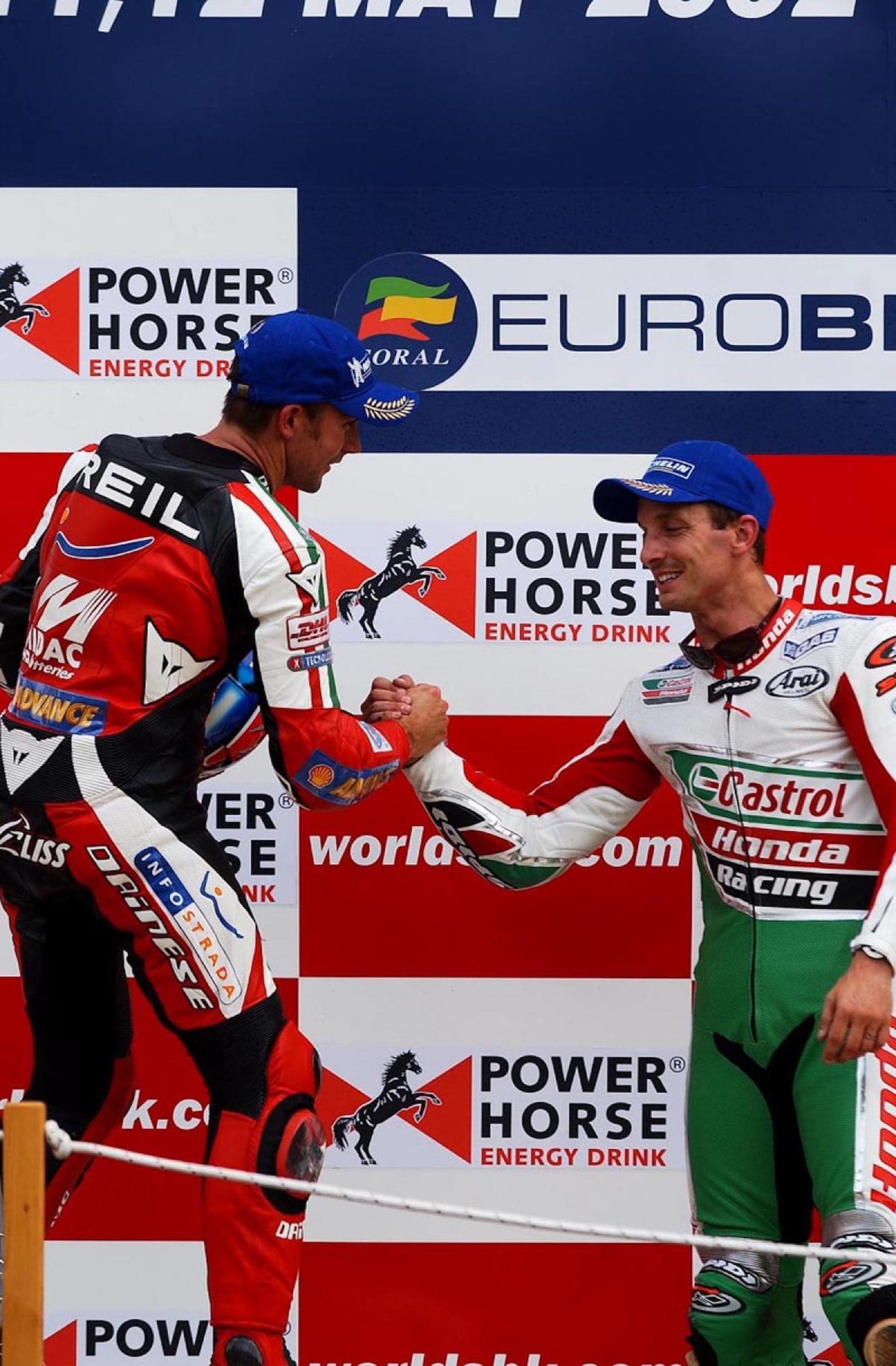 Troy Bayliss and Colin Edwards on the podium for 2002's WorldSBK championship. Media sourced from Crash.net.