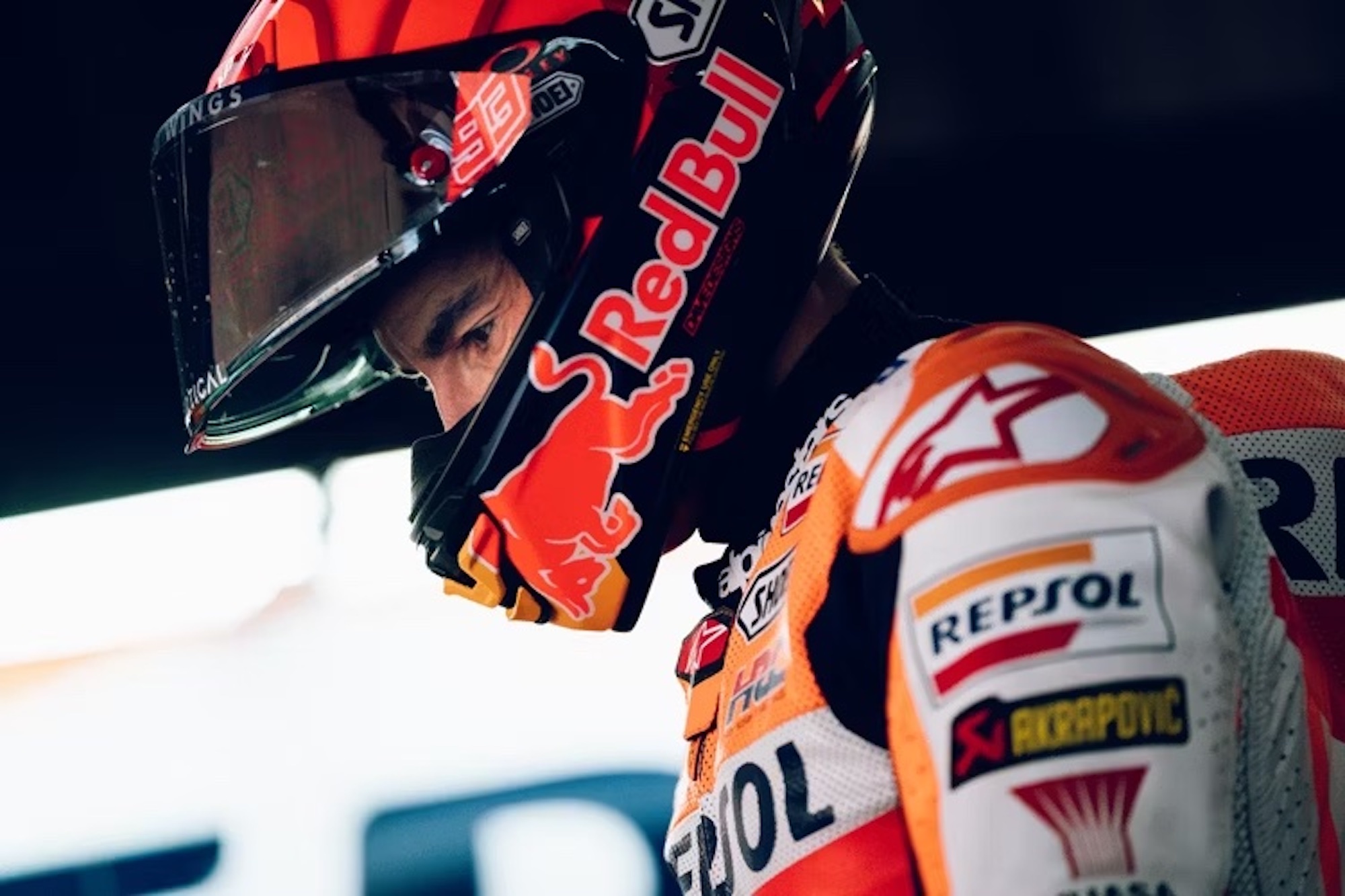 Marc Marquez, lid on, in the MotoGP paddock.  Media sourced from Voi.ID