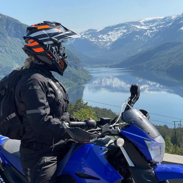 Rider wearing LS2 Explorer Carbon Helmet and Serra Evo jacket