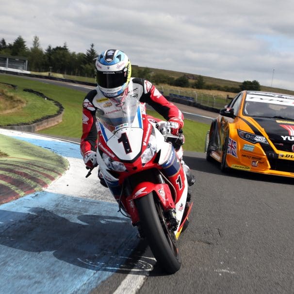 motorcycle and racecar on track