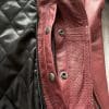 The buttons unfastened on the interior of the jacket