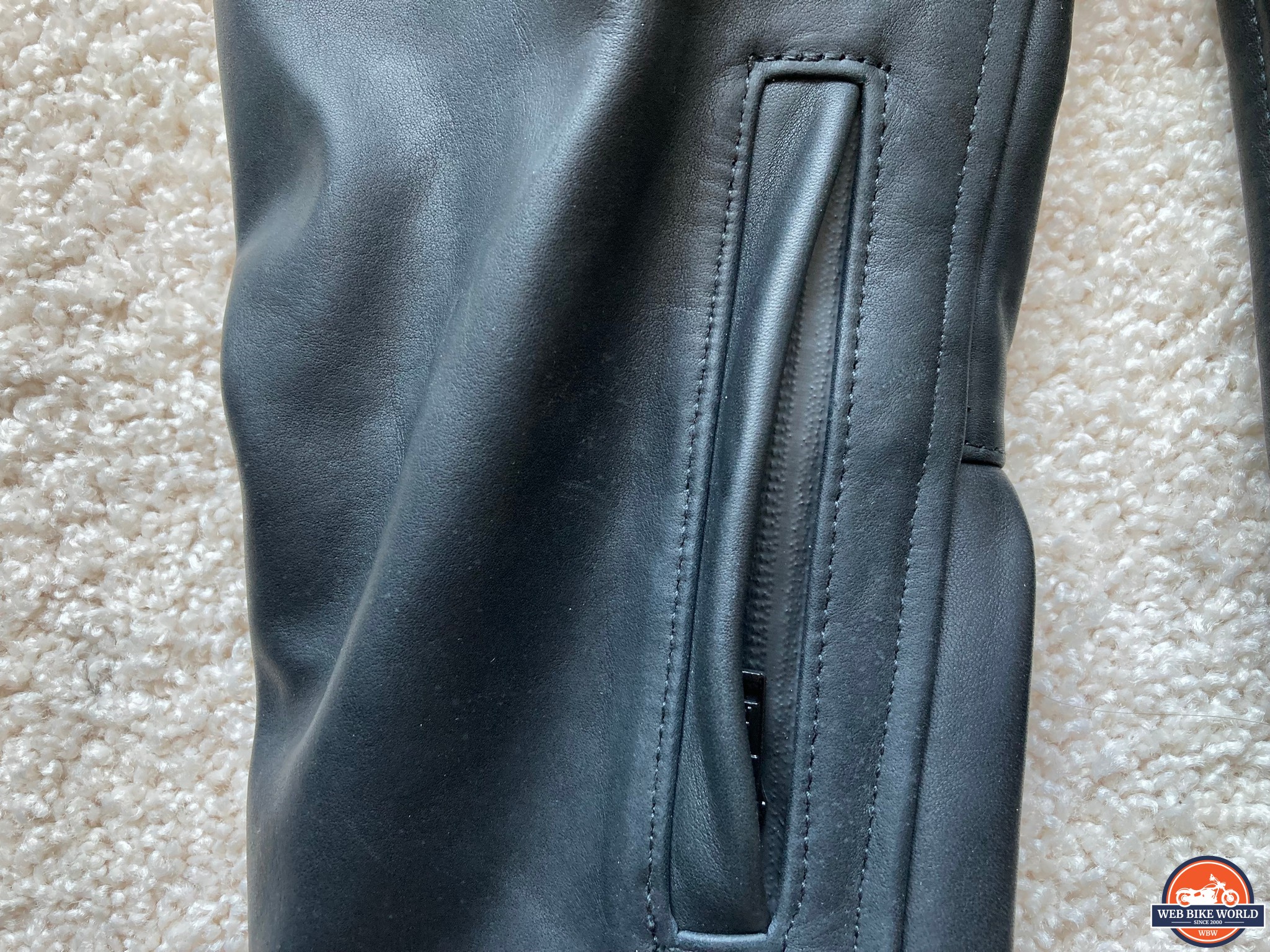 Small zippered pocket on the right front sleeve
