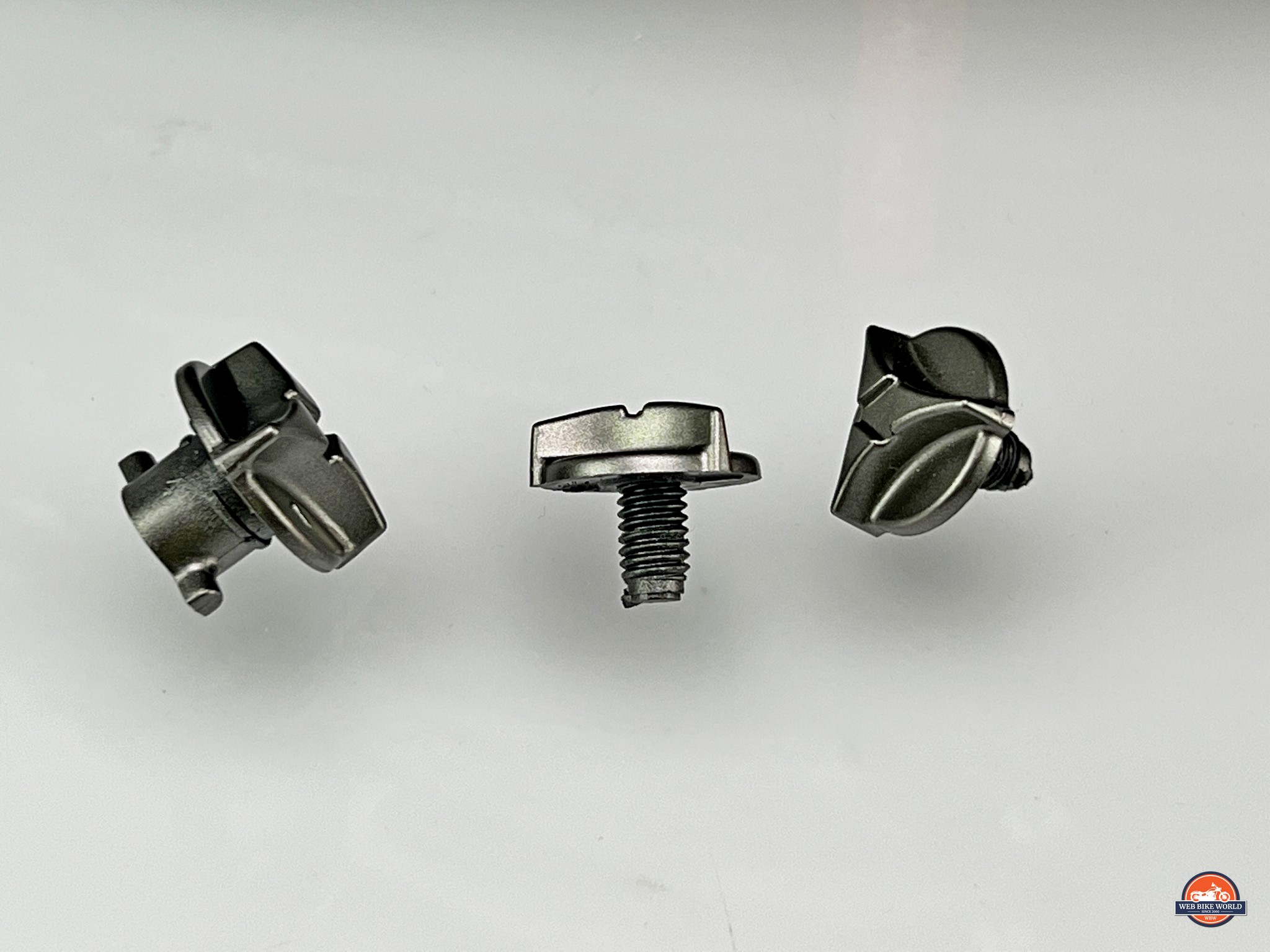 These three fasteners hold the sun peak on the XT9000