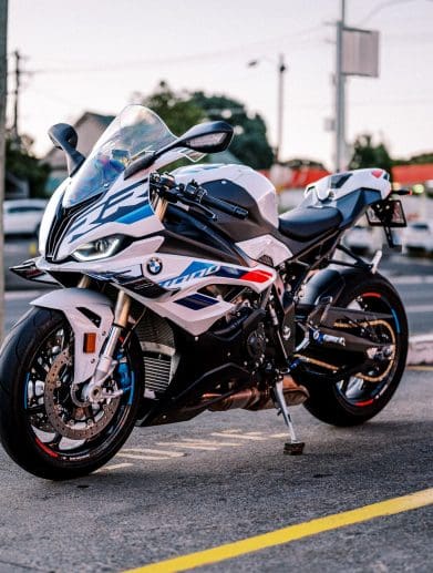 A 2023 BMW S 1000 RR motorcycle parked outside at dusk in Sydney