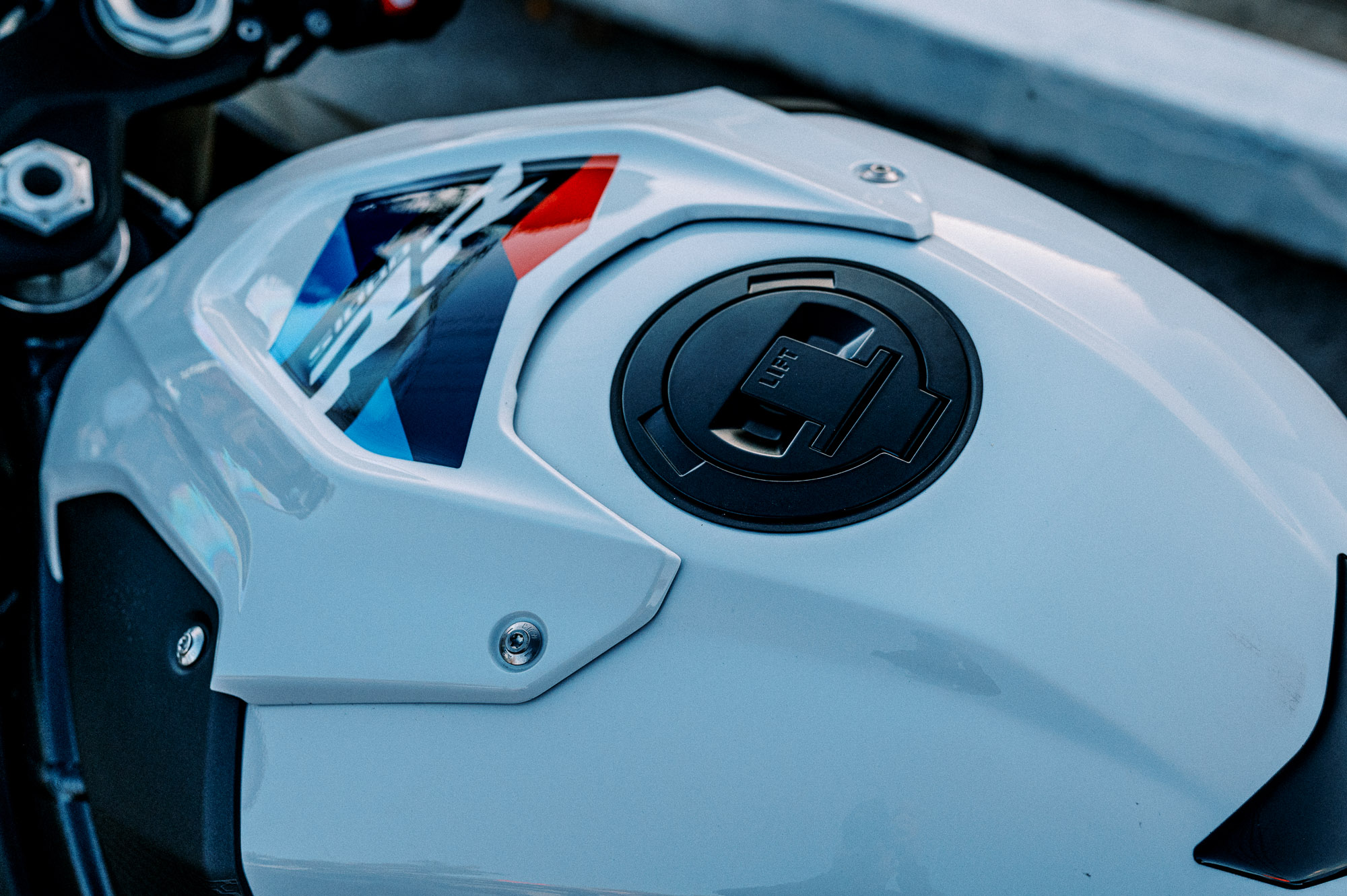 A 2023 BMW S 1000 RR motorcycle parked outside at dusk in Sydney - detail