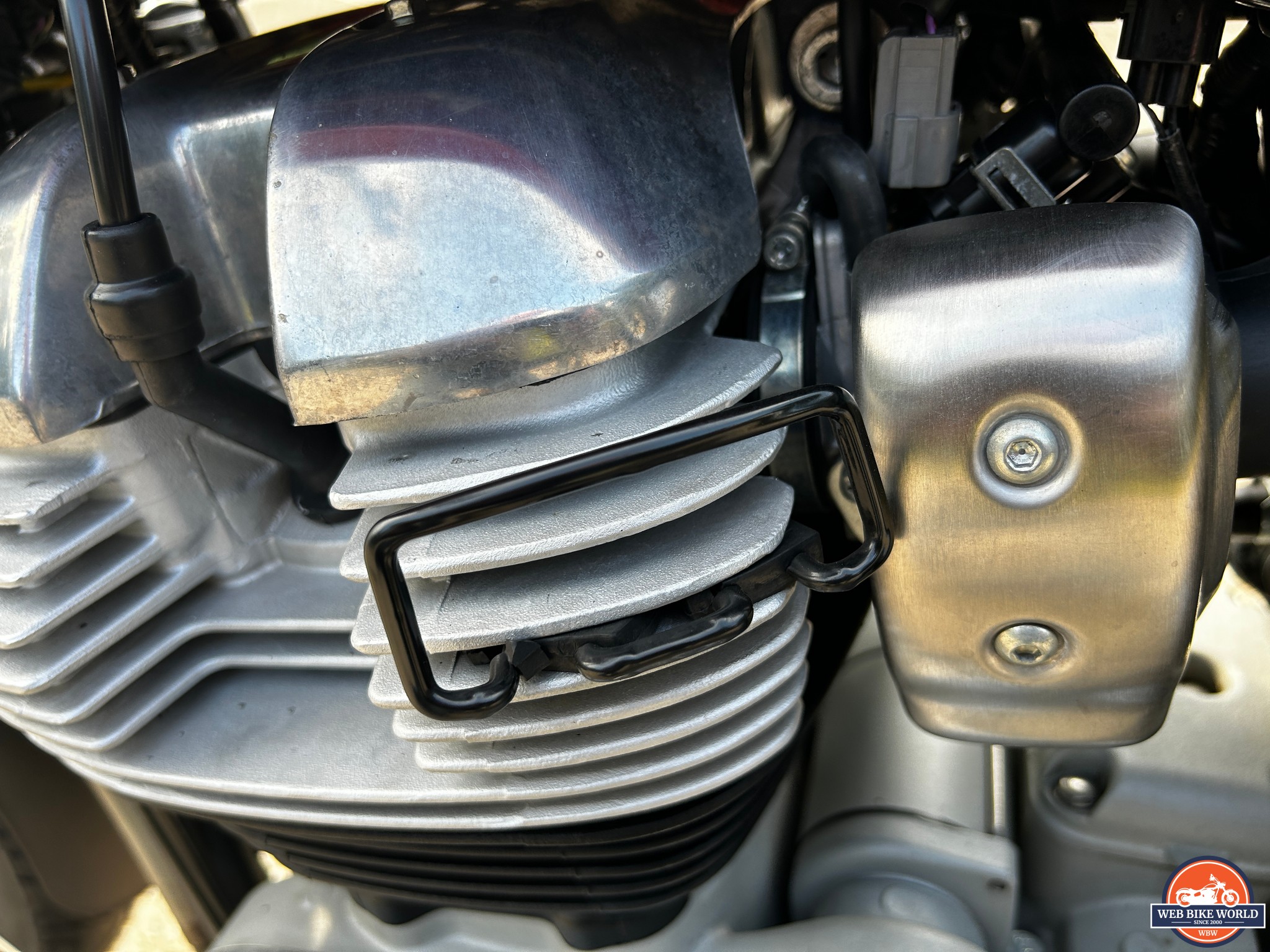 Closeup of knee guards on the Royal Enfield Interceptor 650 engine