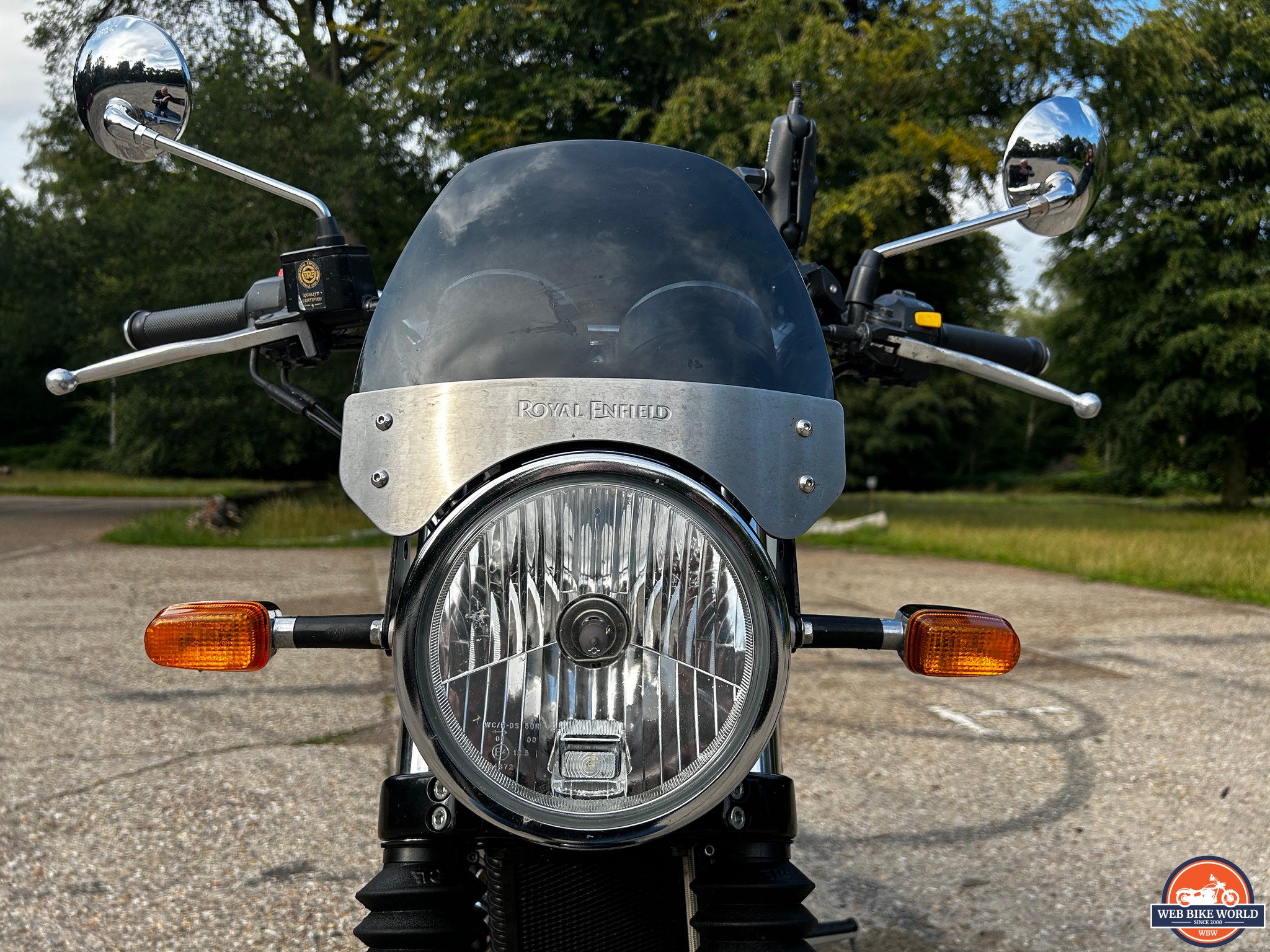 Closeup of the headlights and the brand etched into the metal part of the screen