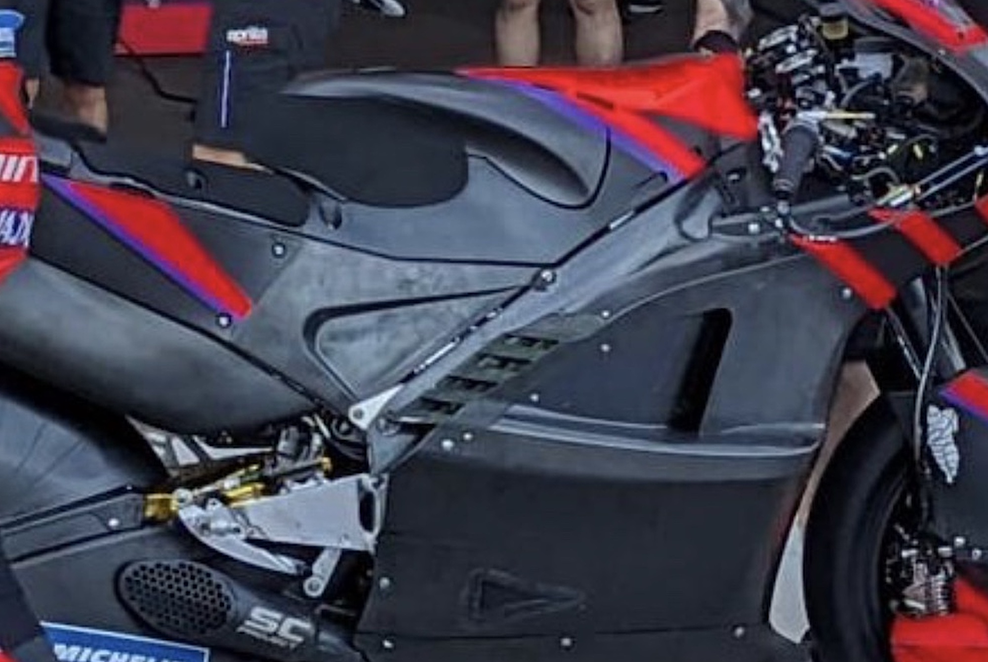 A close-up view of Aprilia's RS-GP with what appears to be a carbon fibre frame. Media sourced from Twitter.