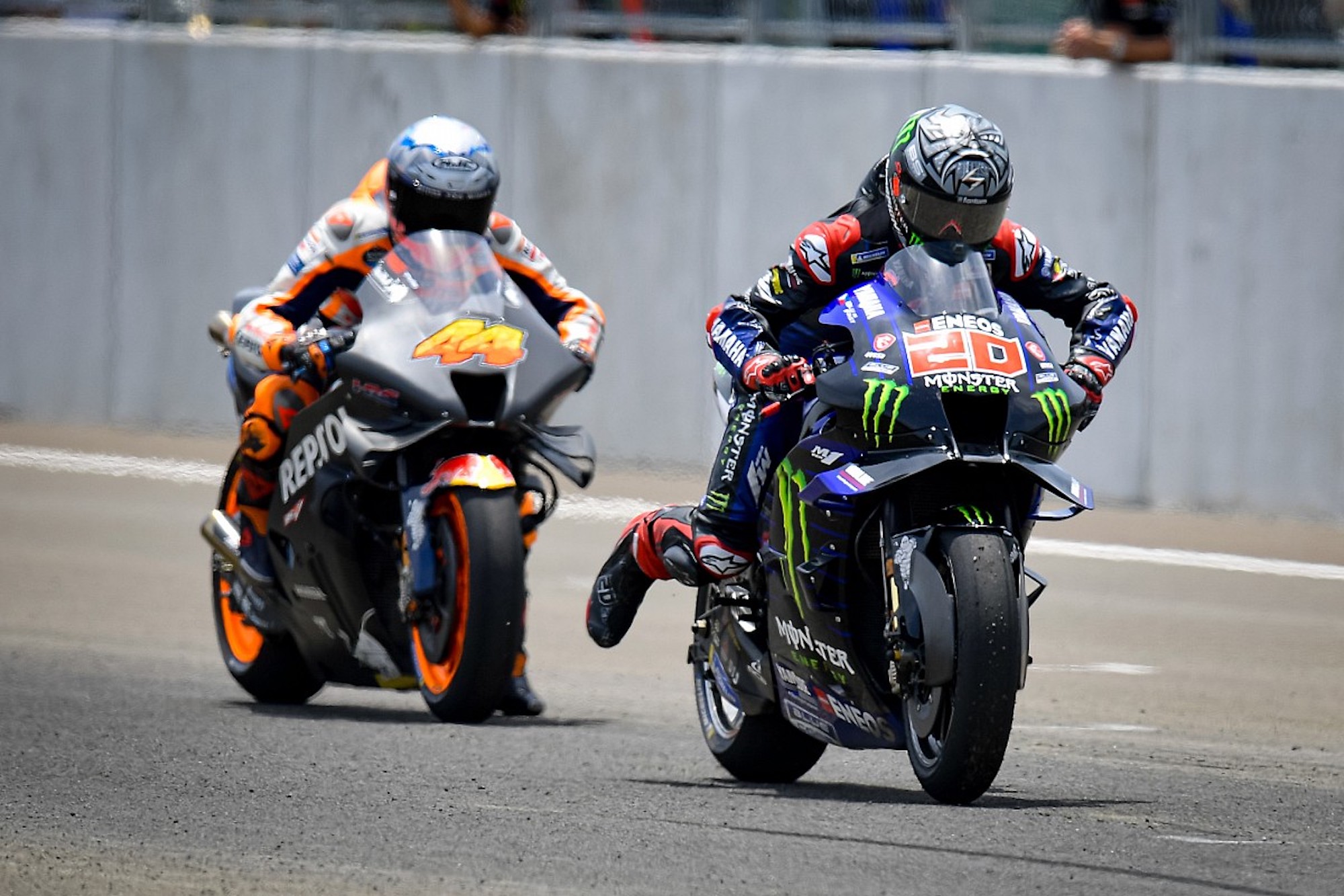 A pair of MotoGP racers getting ready to start their turn off the circuit. Media sourced from Autosport.