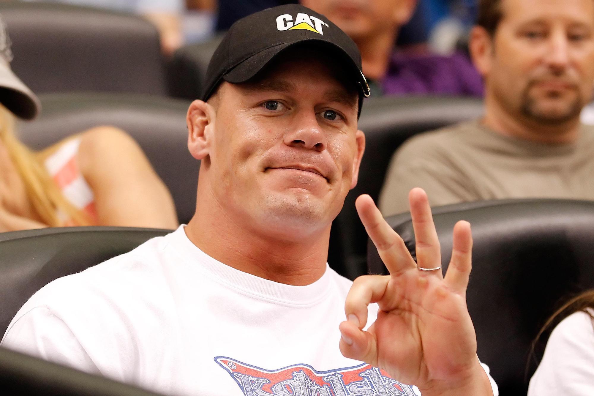 John Cena's iconic hand gesture. Media sourced from Bleacher Report. 