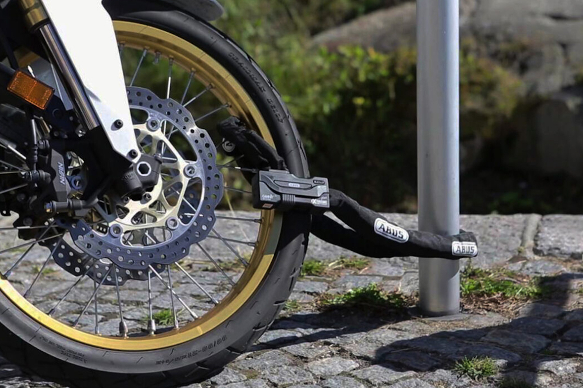 A view of a motorcycle lock. Media sourced from HiConsumption.