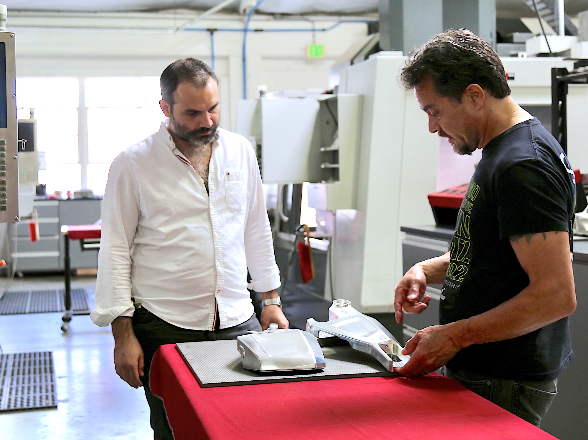 Gerardo Rocha with ARCH Co-Founder Gard Hollinger, looking at a pair of ARCH parts. Media courtesy of the team at ARCH.