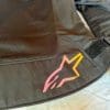 Closeup of the Alpinestars logo at the waist