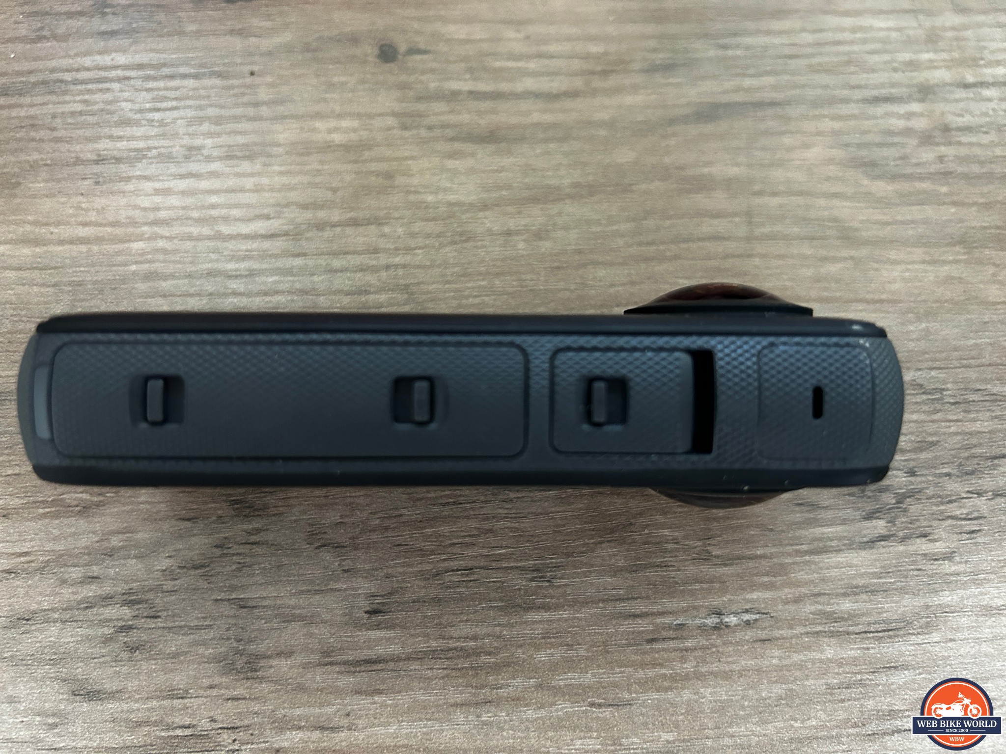 Side view of the X3 showing the battery compartment and the recharging port