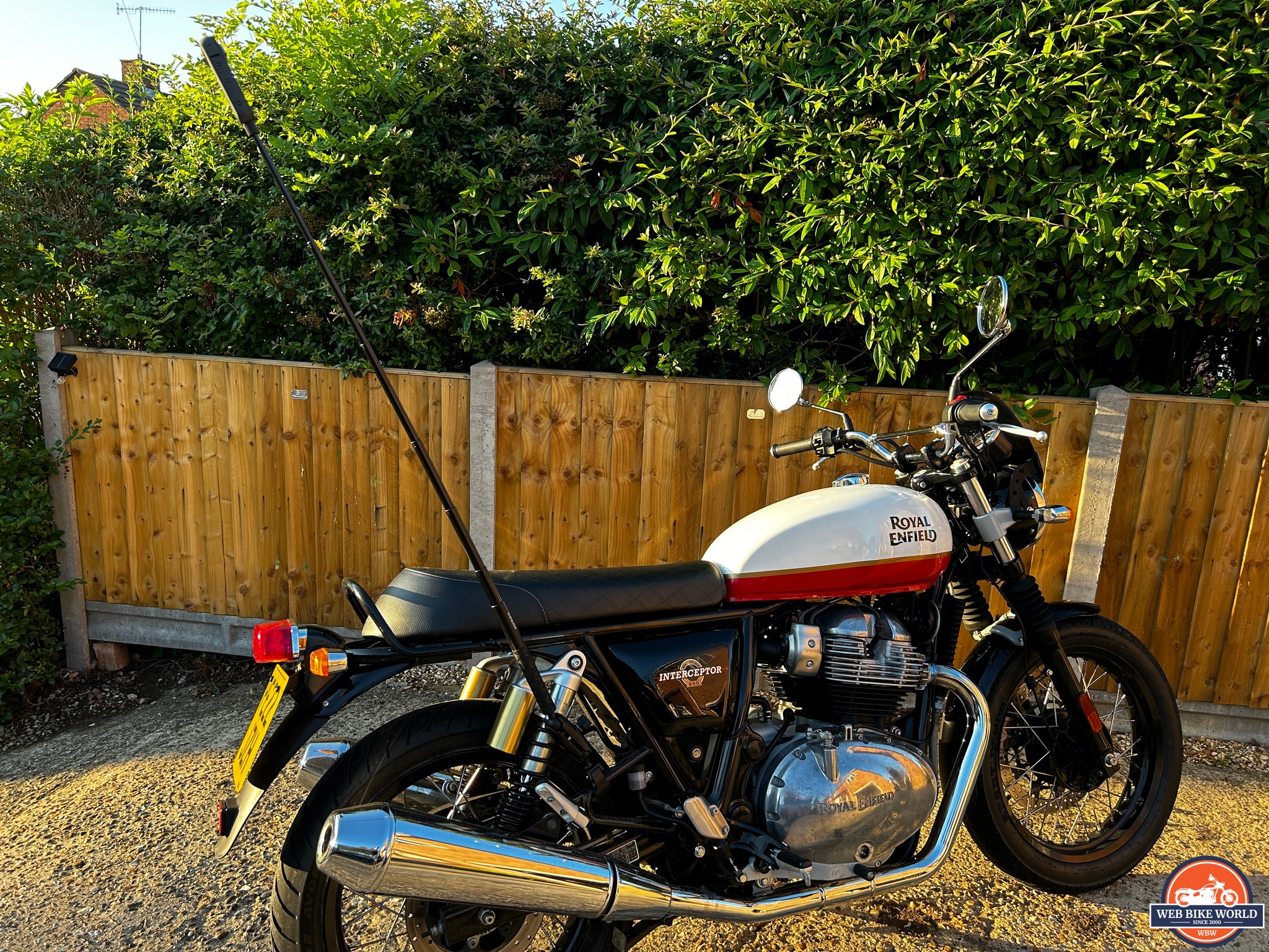 Insta360 X3 Camera attached to motorcycle with selfie stick fully extended