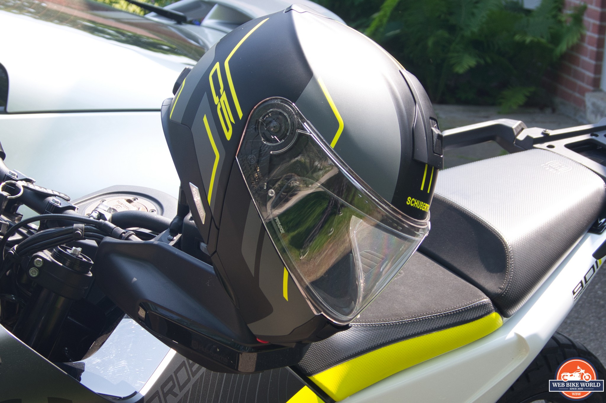 Schuberth C5 Helmet hanging from motorcycle handlebar