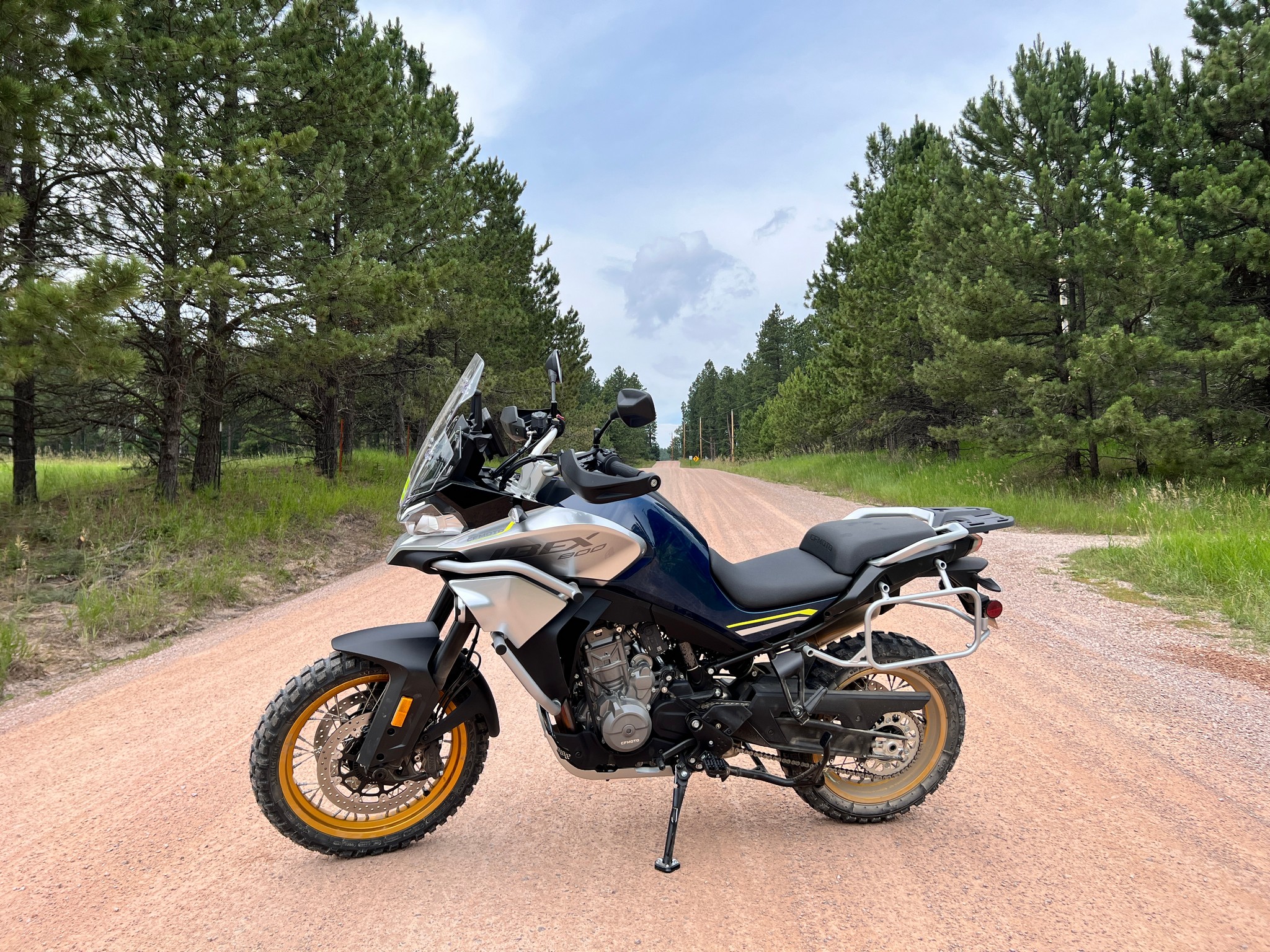 The CFMoto Ibex 800T on a dirt road somewhere in the Black Hills.