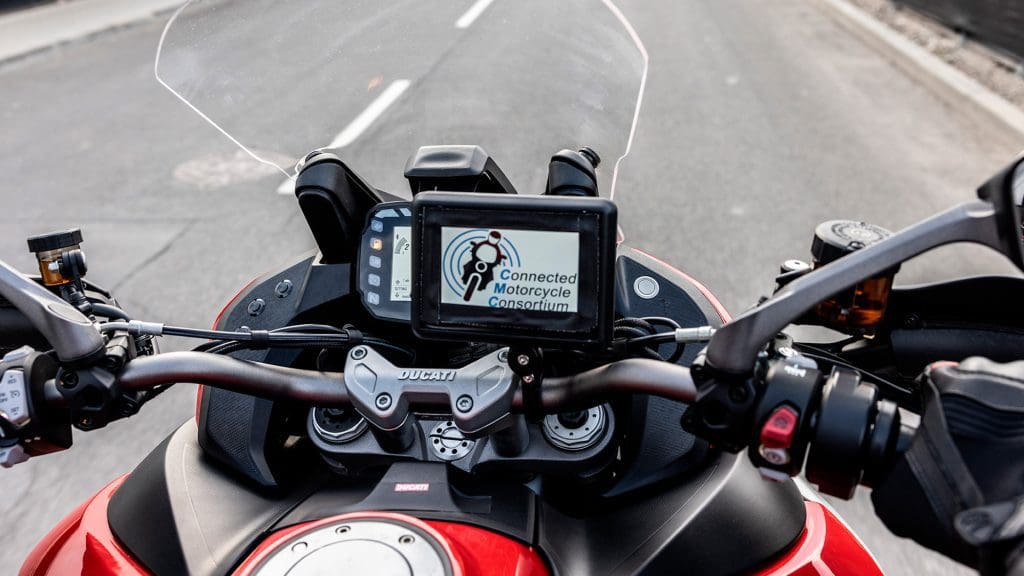 Ducati and Lamborghini at the Connected Motorcycle Consortium (CMC). Media sourced from both Ducati and Lamborghini's press releases.