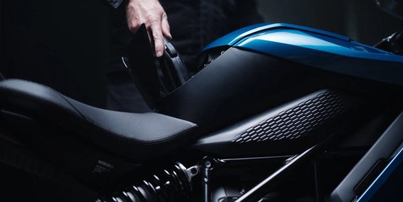 A person charging up an electric motorcycles. Media sourced from Zero Motorcycles.