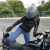 Rider mounting the Harley Davidson Iron 883 wearing the Spidi jacket