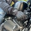 Hand turning the key of a Harley Davidson Iron 883